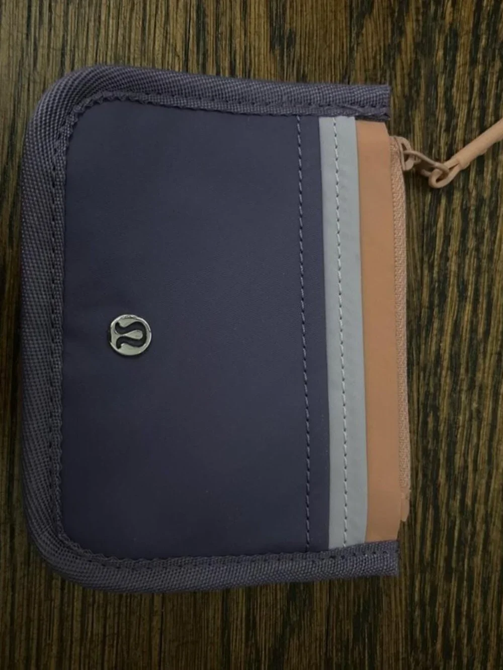 Lululemon purple, lavender, and peach zip up water-resistant cardholder